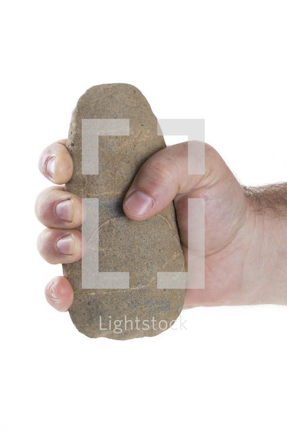 hand grasping a stone 