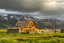 barn in front of a mountain 