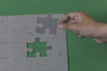 placing the final puzzle piece in place 