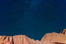 stars over red rock mountains 