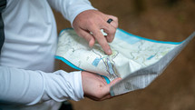 a man looking at a trail map 