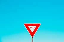 yield sign and blue sky 