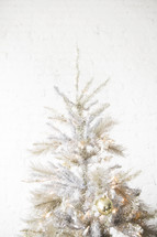 silver, white, and gold Christmas tree