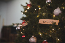 savior ornament on a Christmas tree 