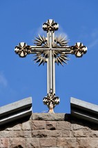 silver cross on a roof 