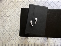 AirPods on a journal 