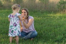 mother and daughter picking flowers 