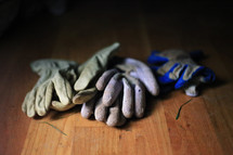 work gloves on a wood floor 