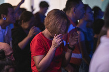 heads bowed during a worship service 