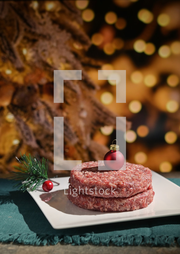 Meat patties with Christmas bauble