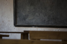 blank chalkboard in a school house 