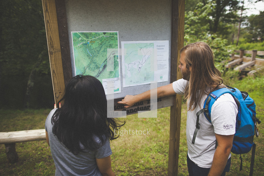reviewing maps before hiking nature trails 