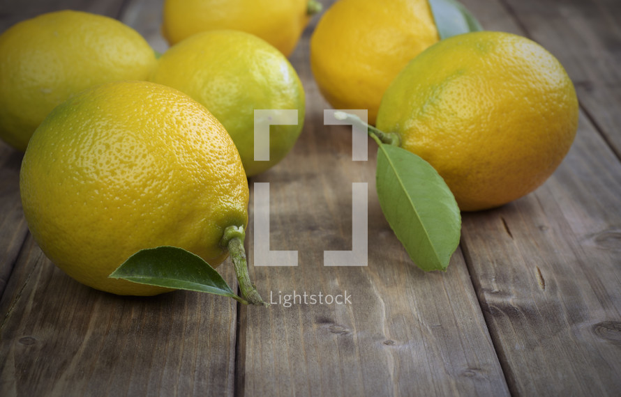 Lemons on a wood board table.