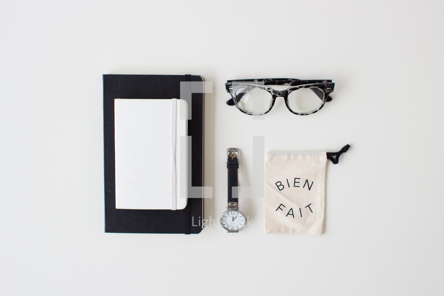 journal, watch, reading glasses, and bag 