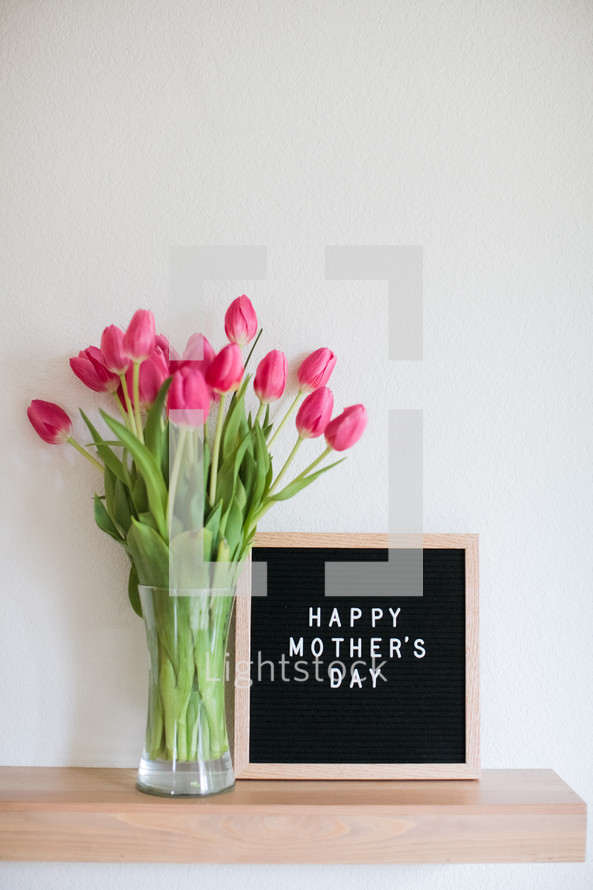 tulips in a vase and a Happy Mother's day sign 
