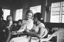 students talking in a classroom 