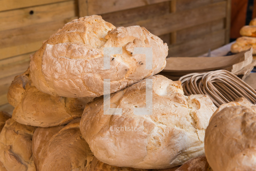Rustic bread loaves on a market stall Badajoz