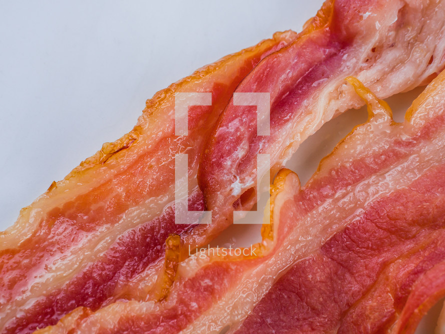 Fresh crispy bacon slices. macro shot. food background. Top view. High quality photo