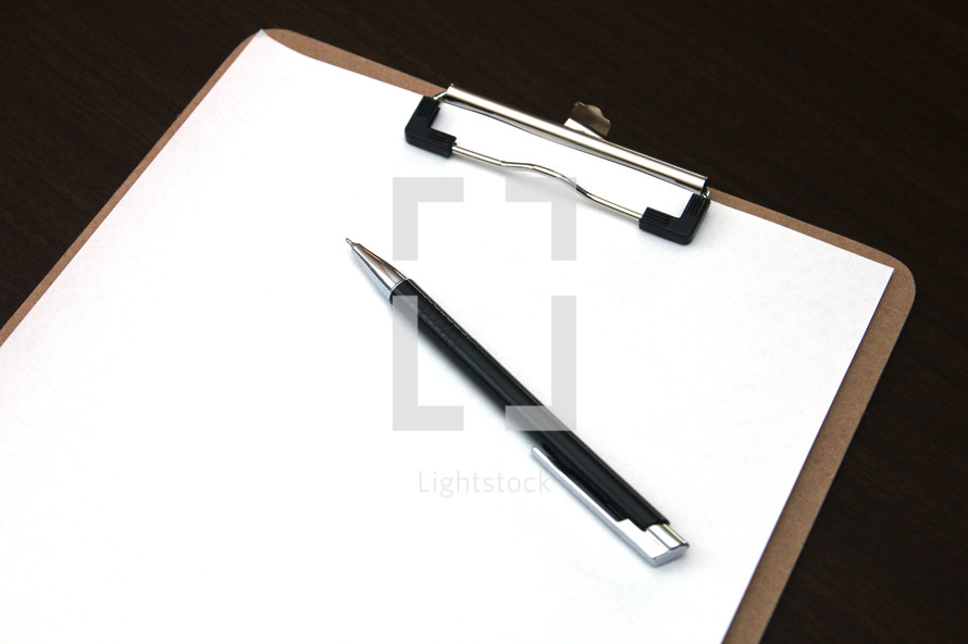 blank clipboard and pen 