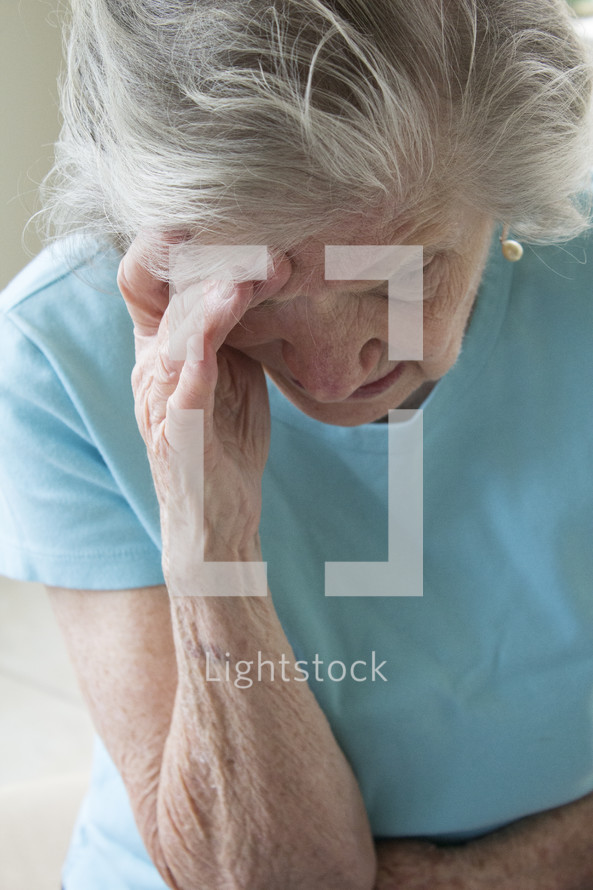 stressed elderly woman