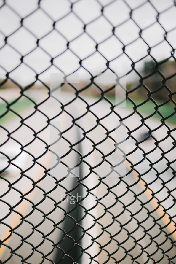 chain link fence and road 