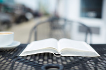 open Bible on an outdoor table 