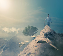 a man standing on a mountaintop 