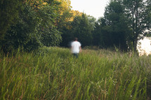 out of focus, man in a field in motion