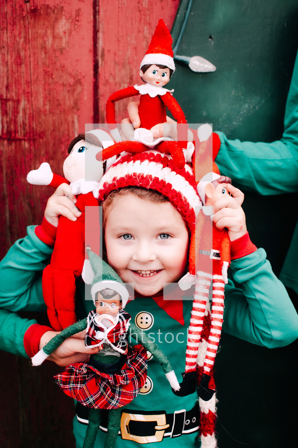 Toddler girl with Christmas hat and elves