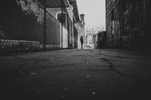 man standing in an alley in downtown NYC