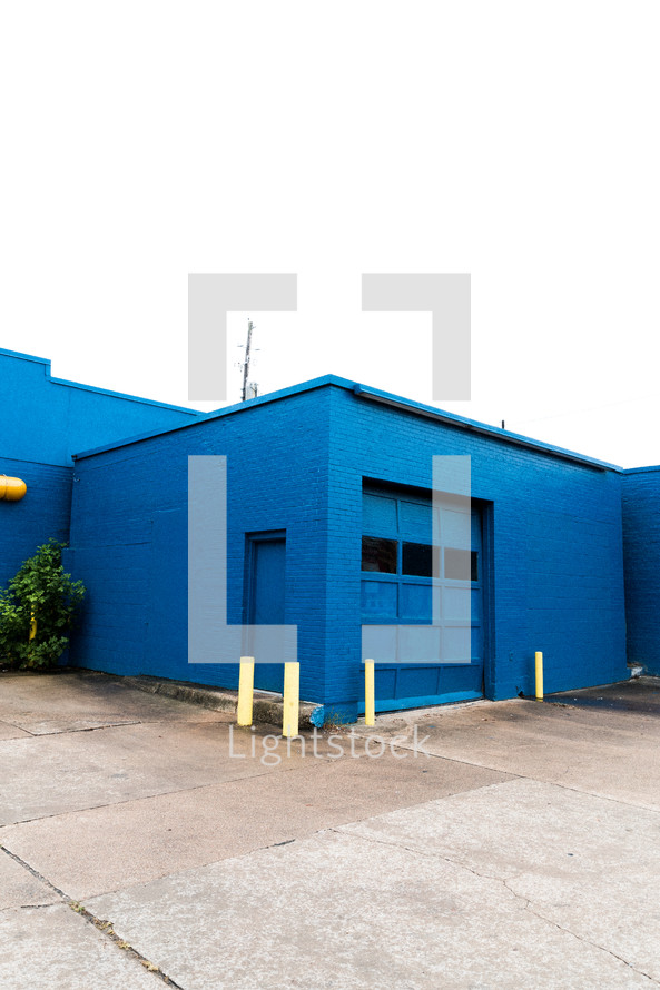 blue brick building and garage door 