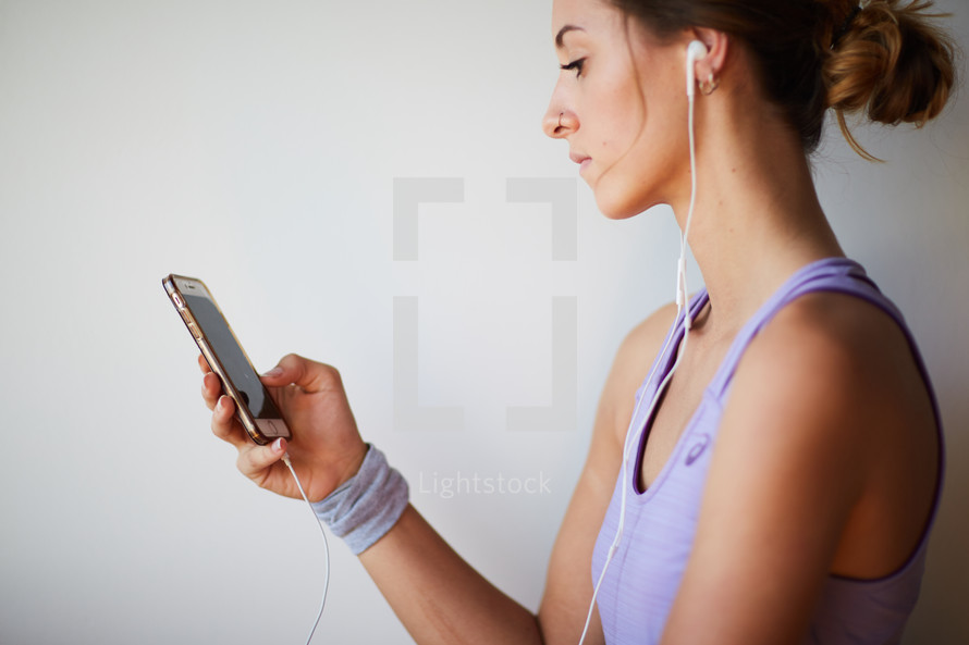 woman listening to music on an iPhone 