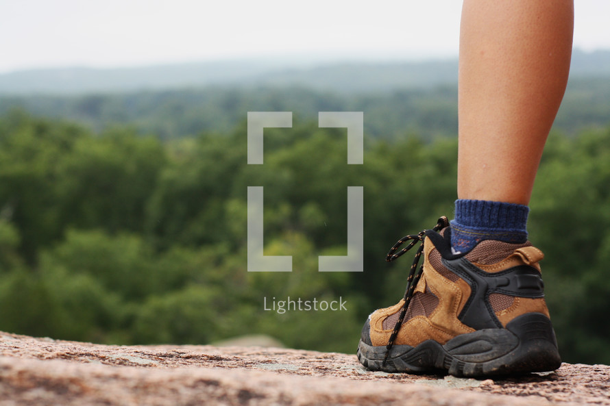 hiking boots on a mountaintop