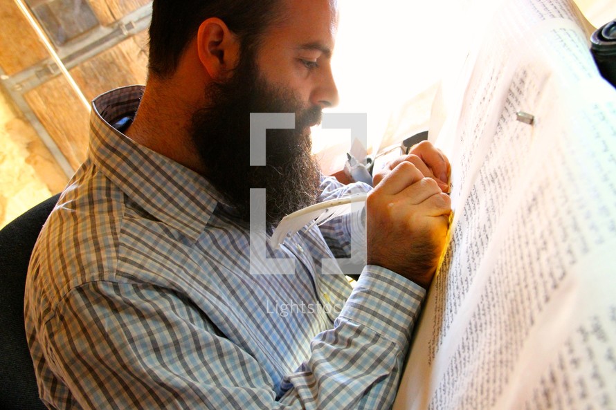 Rabbi hand-writing the Torah