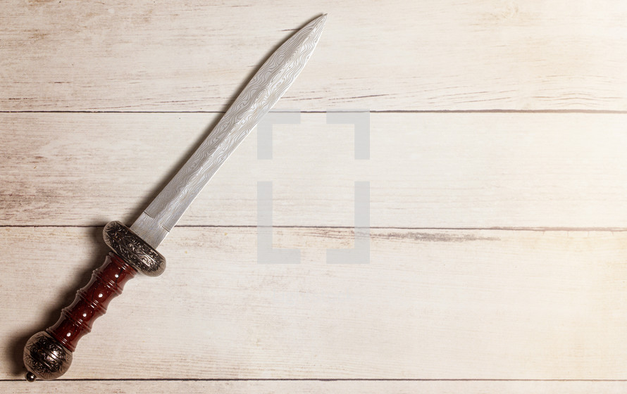 sword on a wood background 