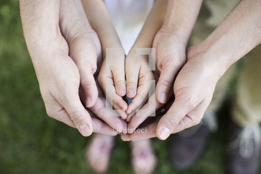 hands of a family 