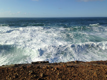 waves washing onto a shore 