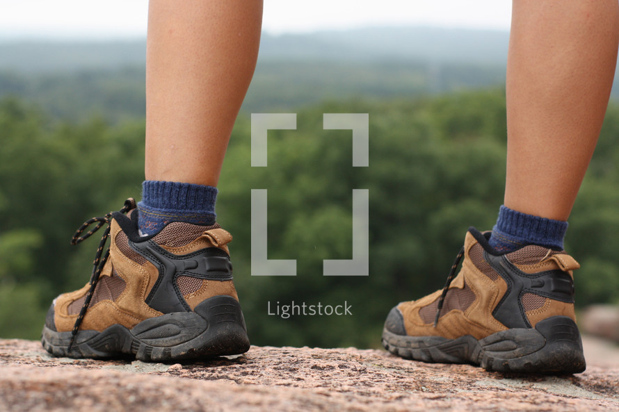 hiking boots on a mountaintop 