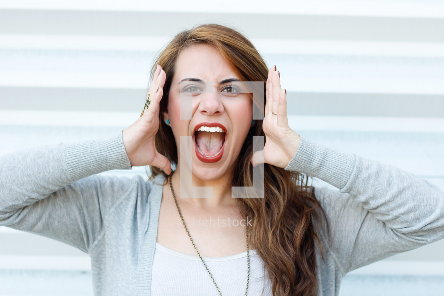 a young woman yelling an announcement 