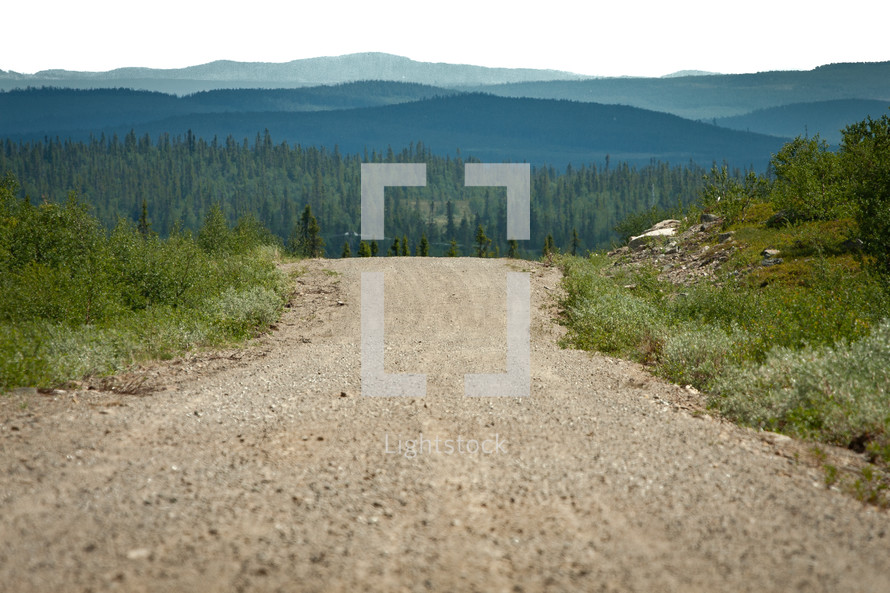 A gravel road up in the mountains