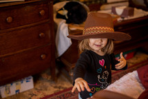 toddler girl in a cowboy hat 