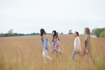group of young women in a field 