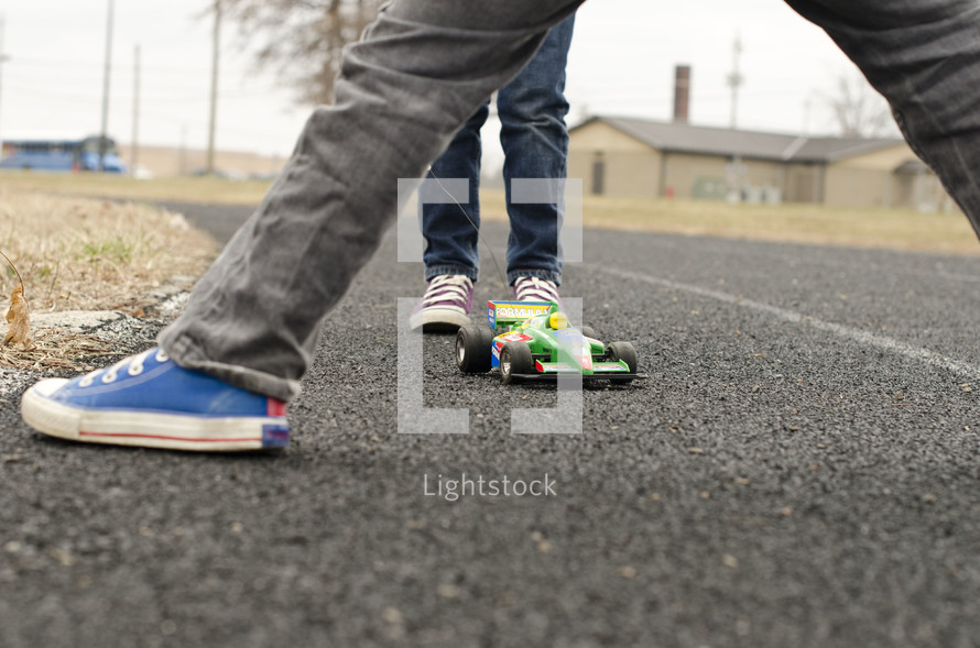children playing with a remote control car