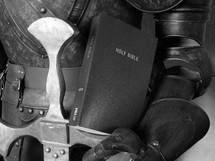 Bible held in a suit of armor.