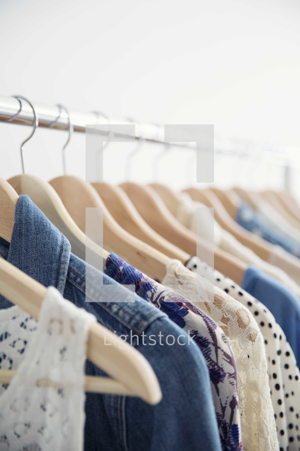 rack of clothes on hangers 