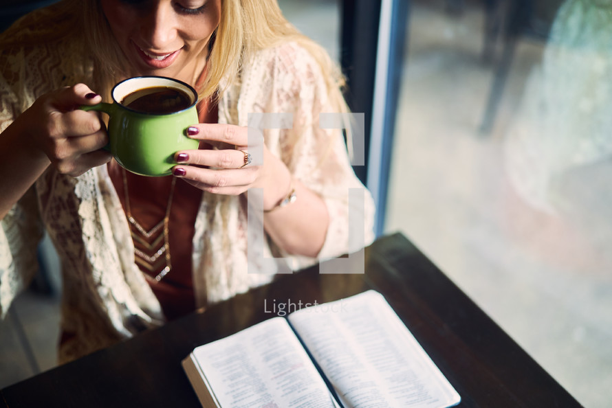 a woman drinking coffee and an open Bible 