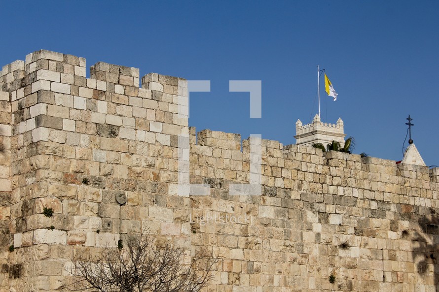 The Walls and Palm Trees around the Old City of Jerusalem (With yellow and white Vatican State flag)