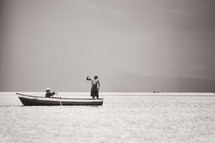 men fishing in a boat 