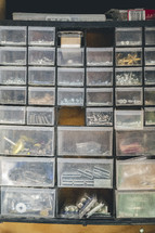 Screws and nails organized in bins