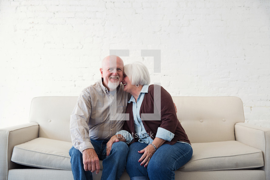 a happy, loving elderly couple 